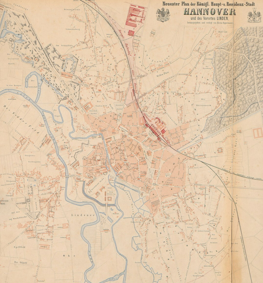 Antique city map of a German city spread on a table with a brass compass