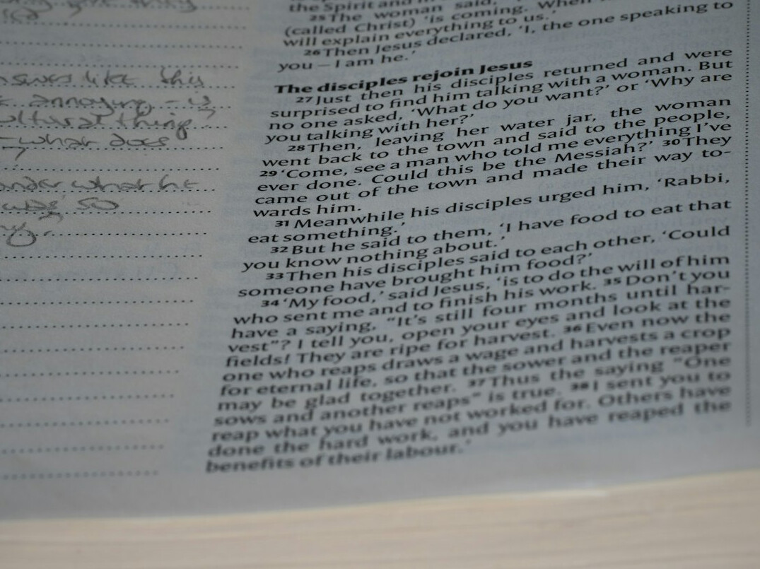 Stack of typed investigation reports with handwritten margin notes and a fountain pen